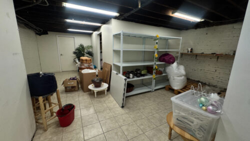 Basement storage area with built-in shelving