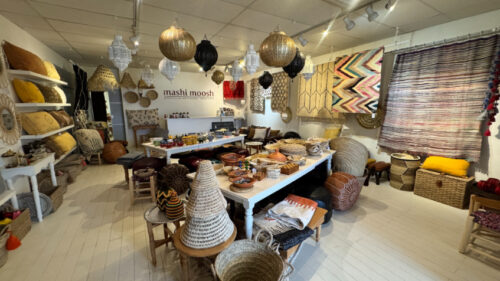 Main retail showroom with track lighting and open floor plan
