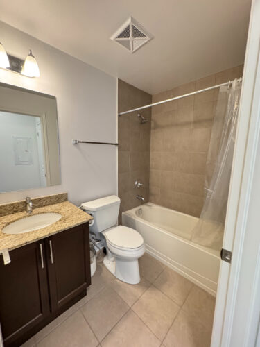 Four-piece bathroom with soaker tub and vanity, Suite 319, Windows on the Green, Erin Mills, Mississauga