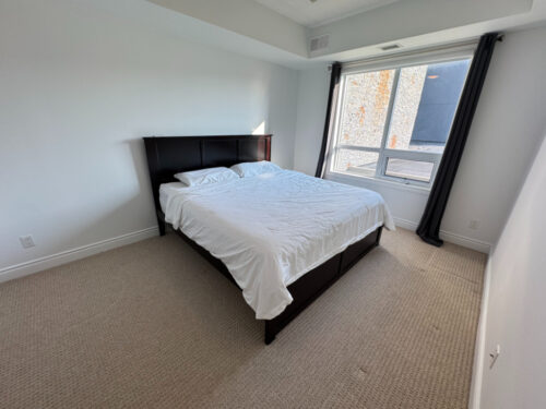 Bedroom with a large window, Suite 319, Windows on the Green, Erin Mills, Mississauga
