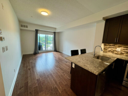 Open living and dining area with hardwood floors, Suite 319, Windows on the Green, Erin Mills, Mississauga