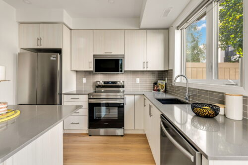 kitchen with island and new appliances william duncan road downsview park toronto