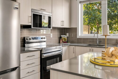 kitchen with new stainless stove and microwave william duncan road downsview park toronto