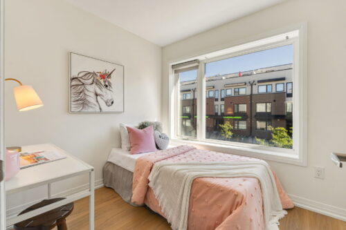 second bedroom with large window william duncan road downsview park toronto