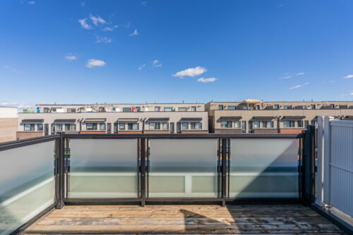 rooftop terrace with glass railing and neighbourhood views william duncan road downsview park toronto